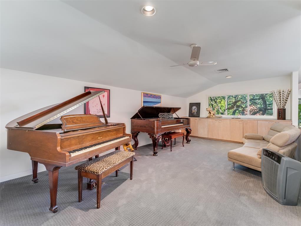 10406 Crestover Drive Dallas, TX 75229 - Photo 19 of 30 a bedroom with furniture and a large window