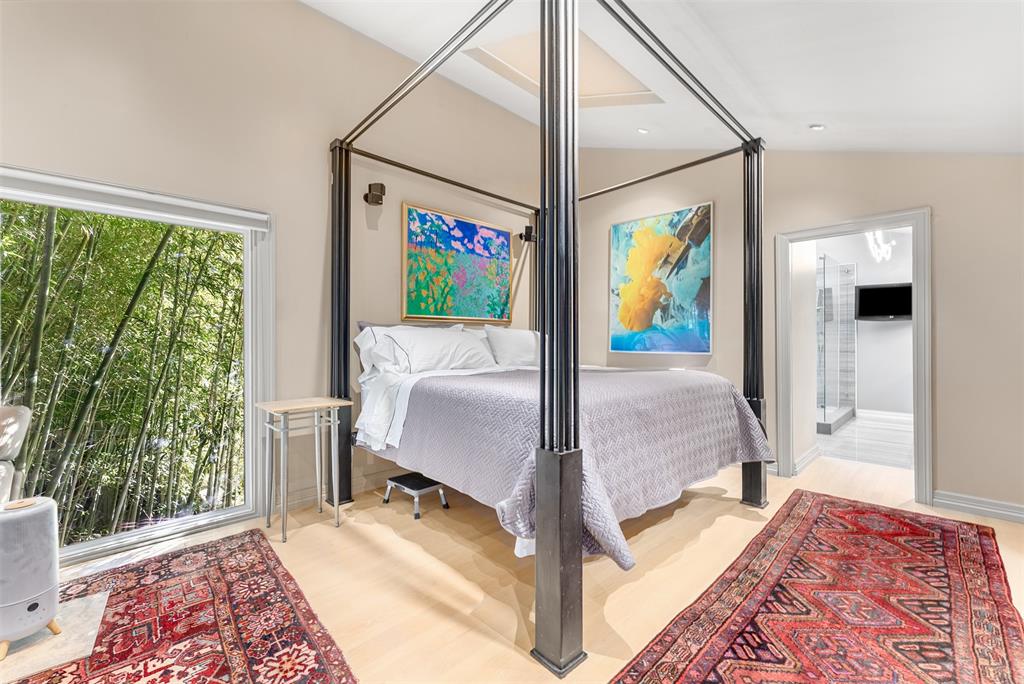 10406 Crestover Drive Dallas, TX 75229 - Photo 20 of 30 a bed room with a bed and glass door