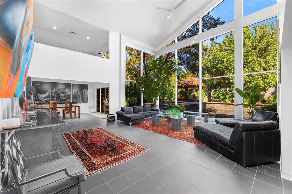10406 Crestover Drive Dallas, TX 75229 - Photo 2 of 30 a living room with patio furniture and a large window