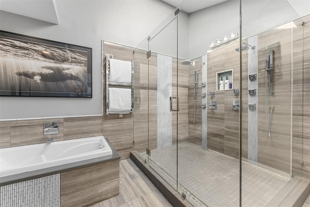 10406 Crestover Drive Dallas, TX 75229 - Photo 23 of 30 a bathroom with a sink and a glass door shower