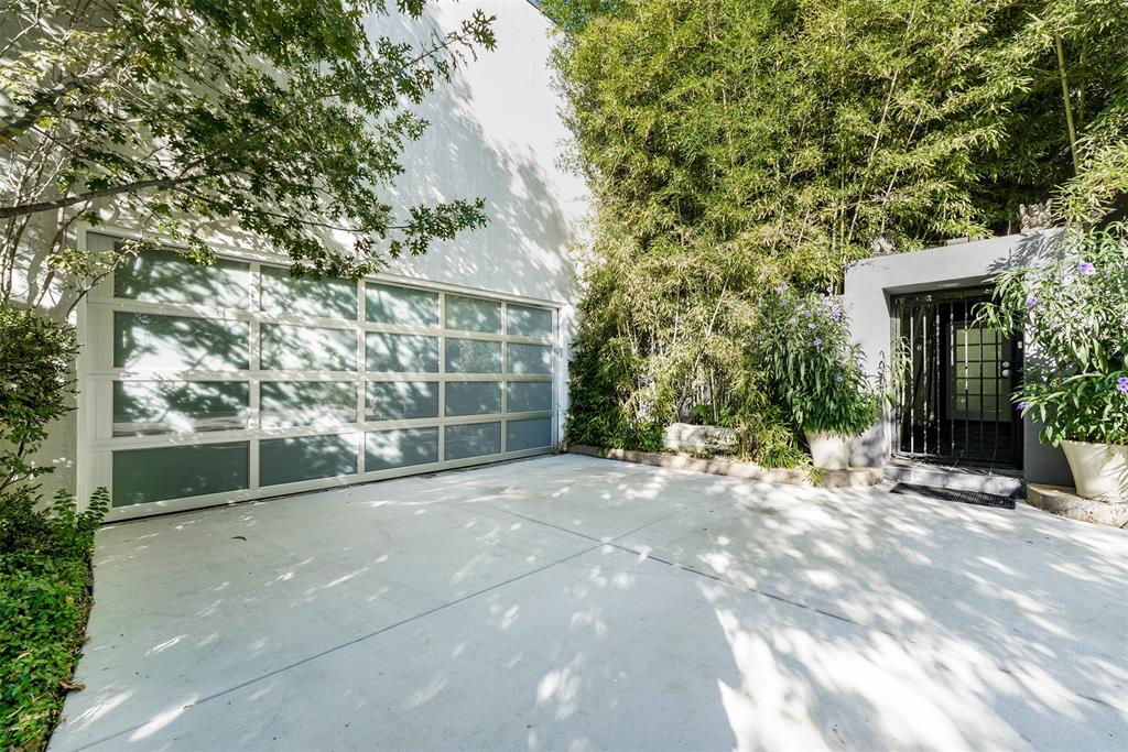 10406 Crestover Drive Dallas, TX 75229 - Photo 5 of 30 a view of a house with a tree and plants
