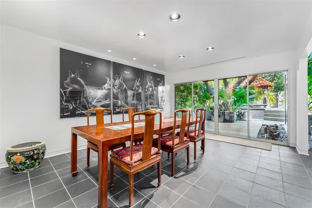a large kitchen with stainless steel appliances granite countertop a sink and stove