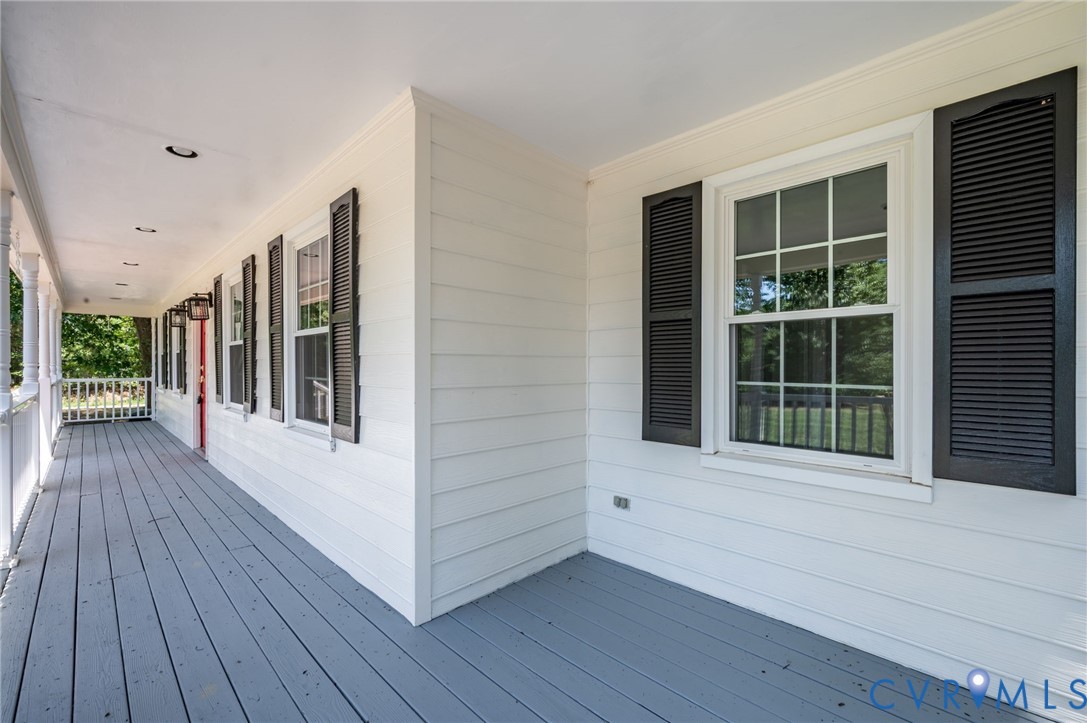 10110 Holly Road Mechanicsville, VA 23116 - Photo 5 of 26 Spacious covered porch with painted wood flooring