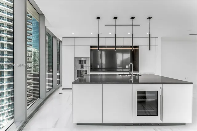 a kitchen with a stove and a refrigerator