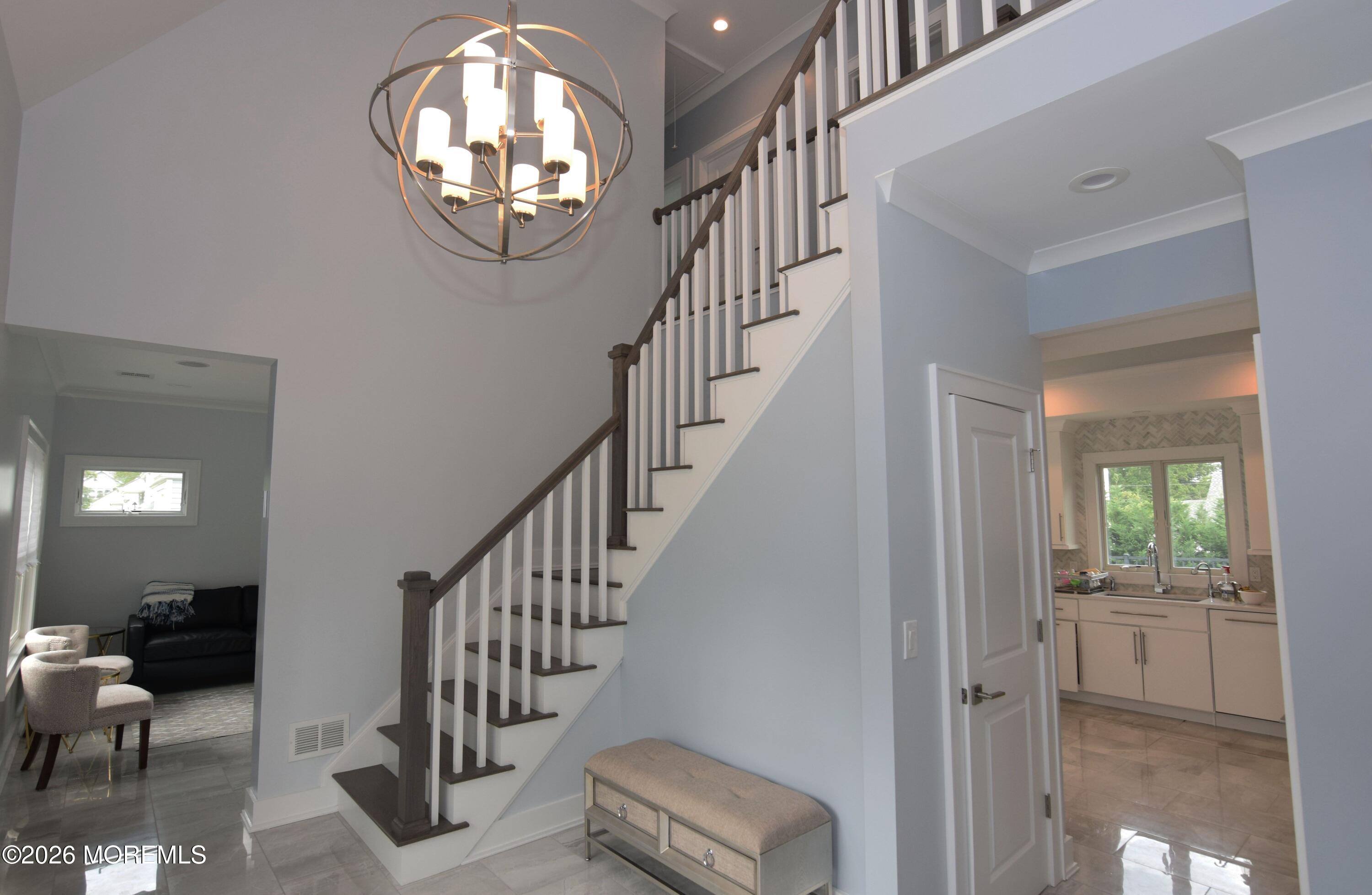 229 Lockwood Avenue, Unit WINTER Long Branch, NJ 07740 - Photo 3 of 19 a view of entryway and hall with wooden floor