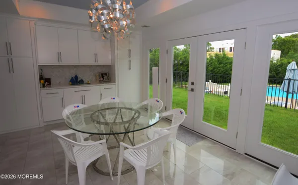 a kitchen with a table and chairs