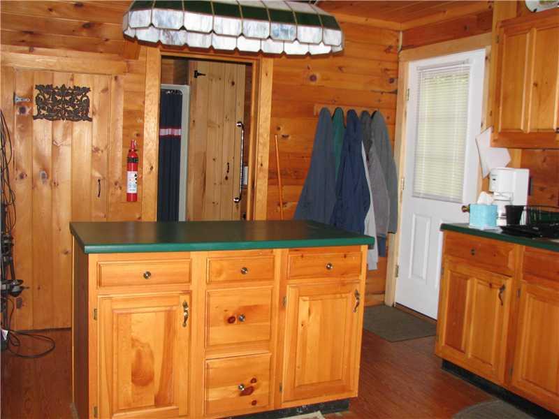 167 Crystal Spring Lane, Unit 20 Rome, ME 04963 - Photo 5 of 31 Kitchen. Island with cabinet space.