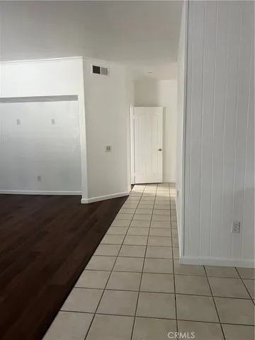 an empty room with wooden floor