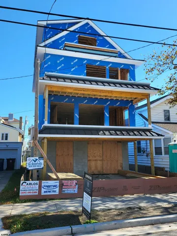 a view of a building with car parked