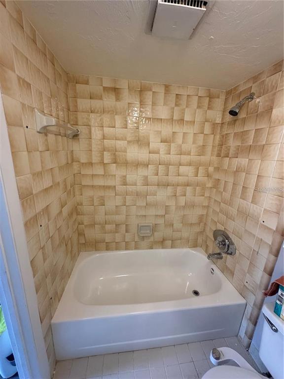 4313 Southwest 68th Terrace Gainesville, FL 32608 - Photo 6 of 14 a bathroom with a bathtub and a shower