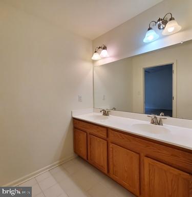 528 Van Dyke Circle Newark, DE 19702 - Photo 12 of 17 a bathroom with a double vanity sink and a mirror