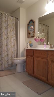 528 Van Dyke Circle Newark, DE 19702 - Photo 16 of 17 a bathroom with a sink and a mirror