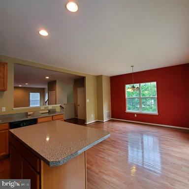 528 Van Dyke Circle Newark, DE 19702 - Photo 8 of 17 a kitchen with stainless steel appliances granite countertop a sink a stove top oven and a counter top space
