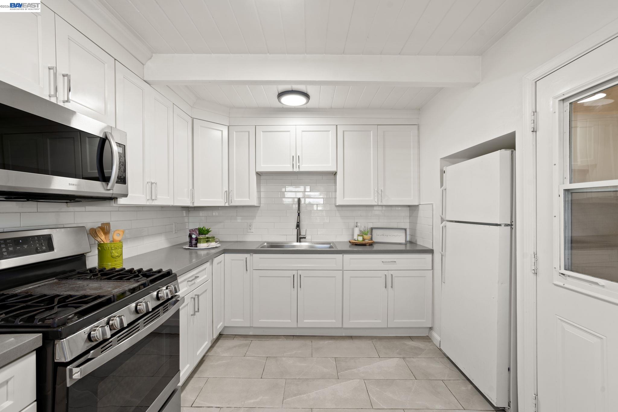 167 Peninsula Road Bay Point, CA 94565 - Photo 11 of 58 a kitchen with cabinets stainless steel appliances and a sink