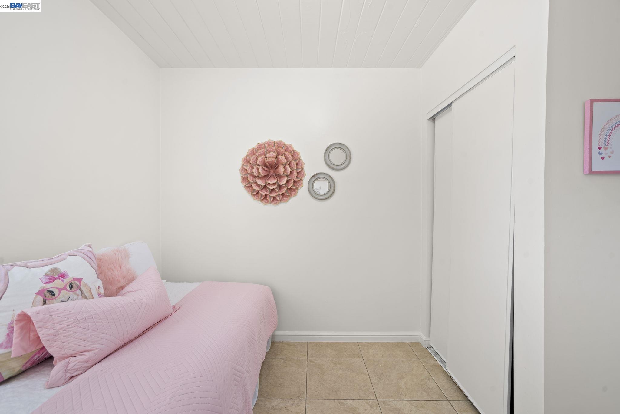 167 Peninsula Road Bay Point, CA 94565 - Photo 15 of 58 a bedroom with a bed and a wall painting