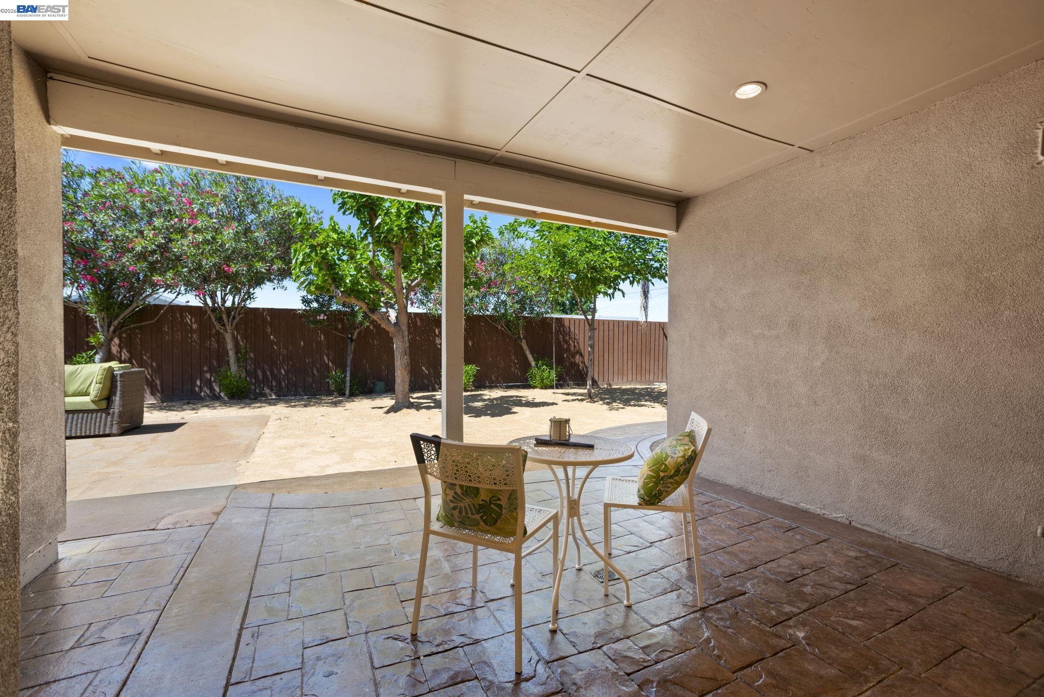 167 Peninsula Road Bay Point, CA 94565 - Photo 23 of 58 a view of a patio with a table and chairs next to a yard