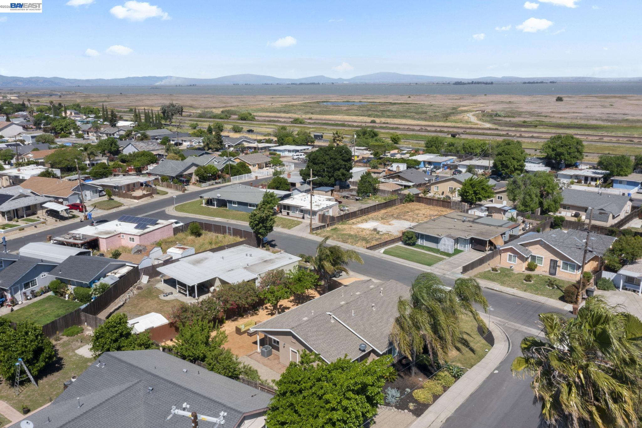 167 Peninsula Road Bay Point, CA 94565 - Photo 53 of 58 an aerial view of a city with lots of residential buildings and ocean view in back