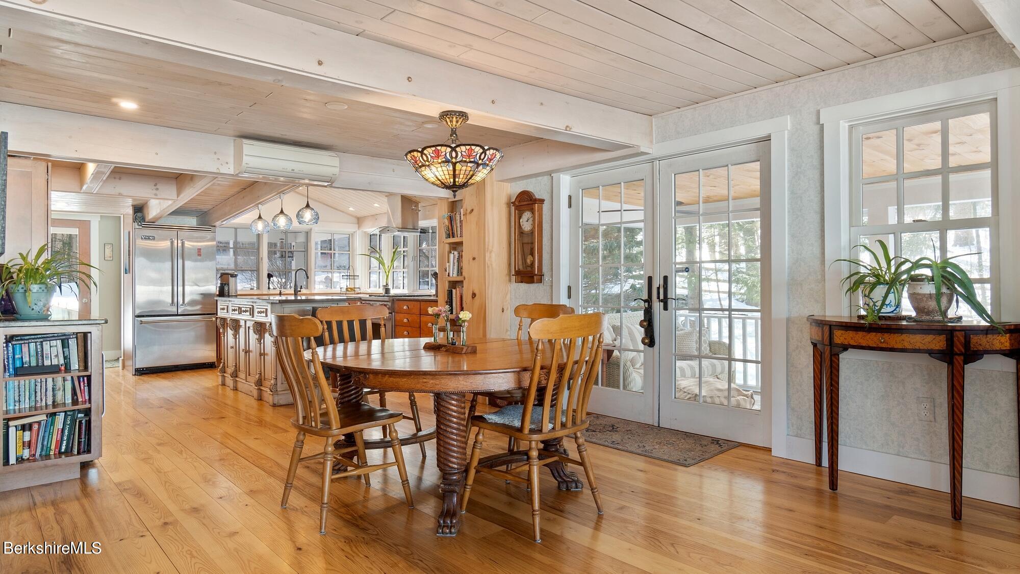 42 Lake Rd Extension Richmond, MA 01201 - Photo 15 of 47 a view of a dining room with furniture window and wooden floor