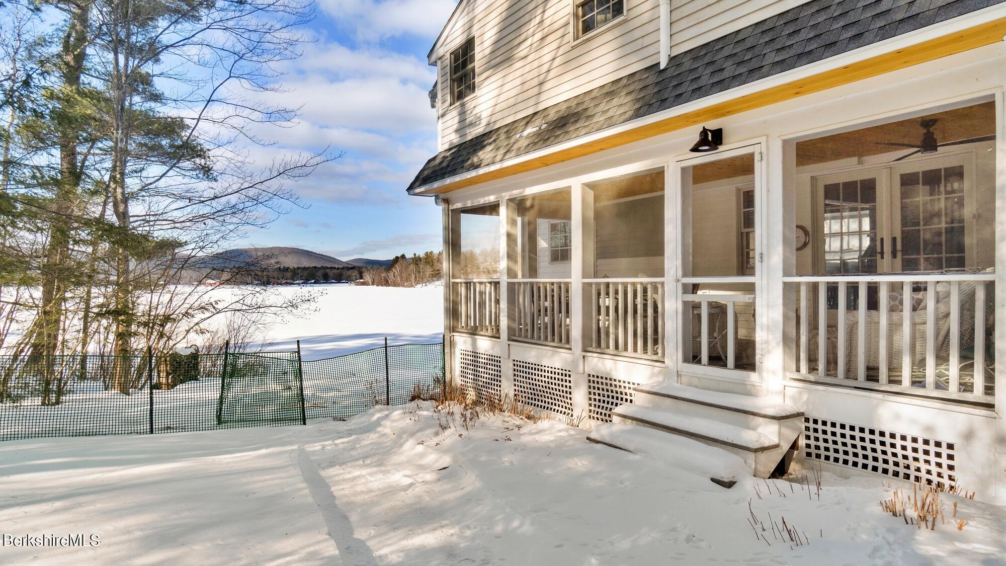42 Lake Rd Extension Richmond, MA 01201 - Photo 17 of 47 a view of a house with a wooden fence
