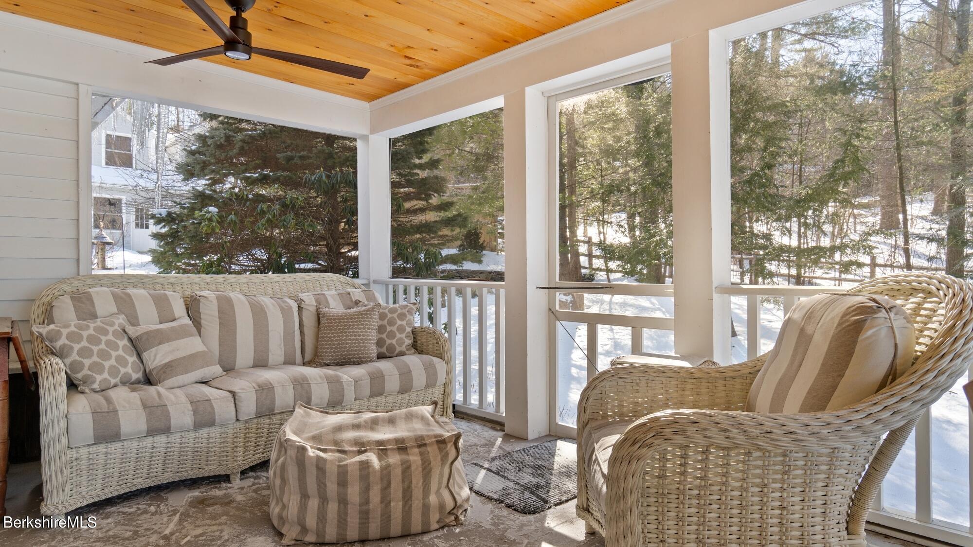 42 Lake Rd Extension Richmond, MA 01201 - Photo 19 of 47 a living room with furniture and a large window