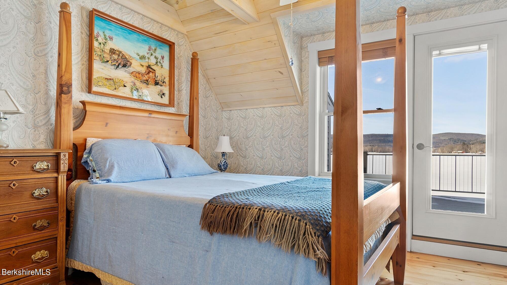 42 Lake Rd Extension Richmond, MA 01201 - Photo 24 of 47 a bedroom with a bed and a painting on the wall