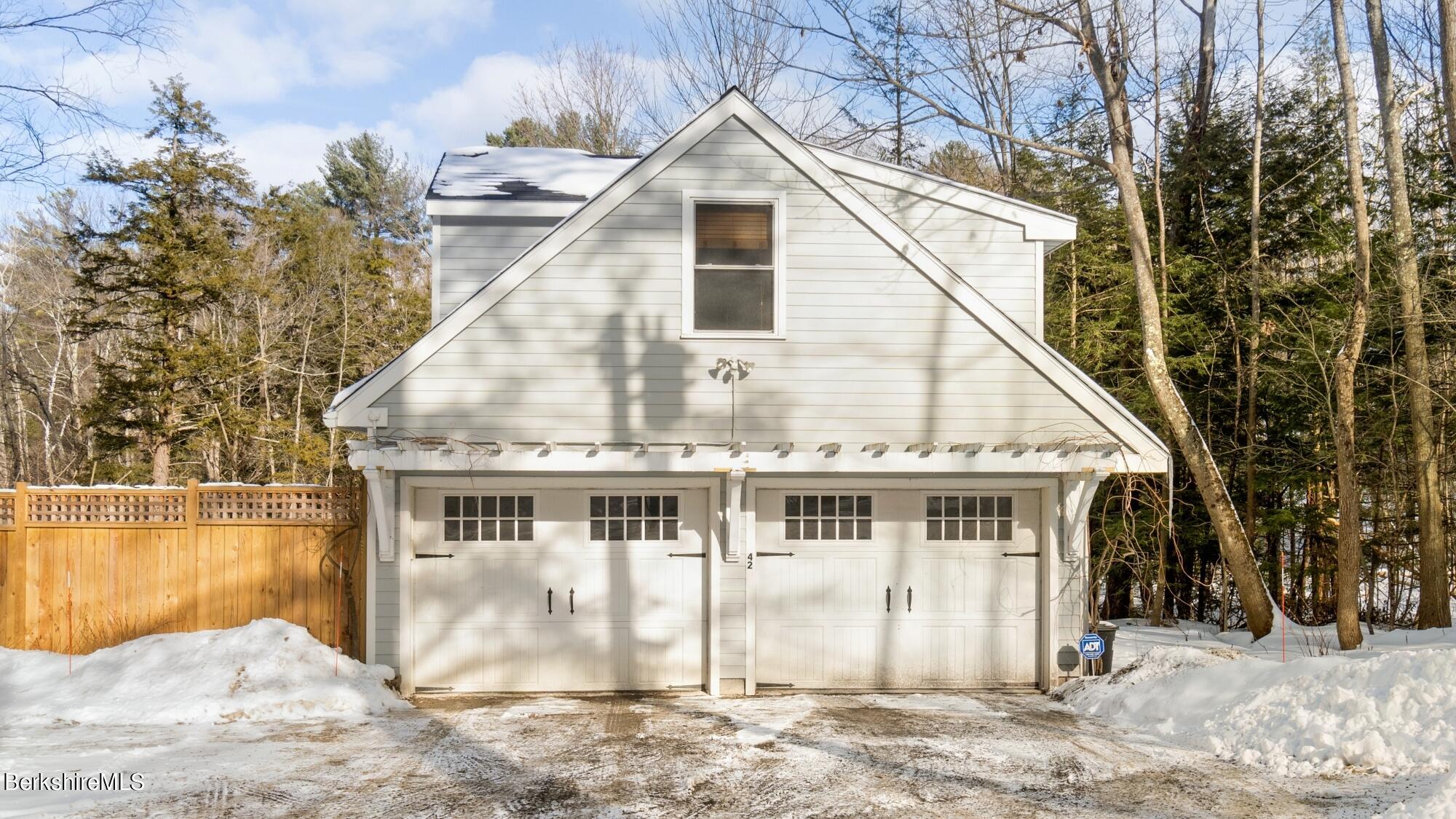 42 Lake Rd Extension Richmond, MA 01201 - Photo 33 of 47 a view of a white house with a yard