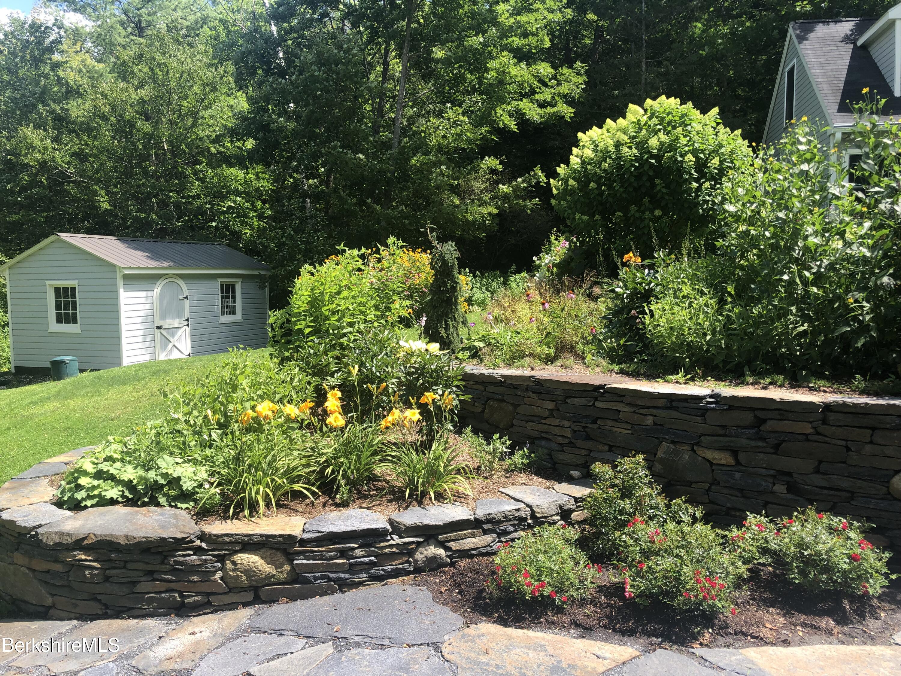 42 Lake Rd Extension Richmond, MA 01201 - Photo 36 of 47 a front view of a house with a yard