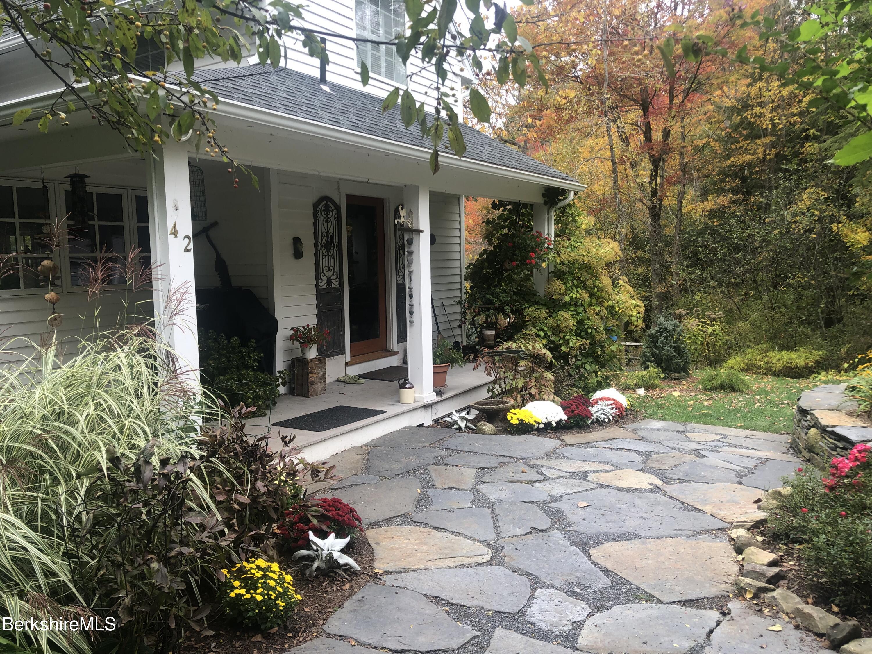 42 Lake Rd Extension Richmond, MA 01201 - Photo 6 of 47 a view of a house with a backyard and garden