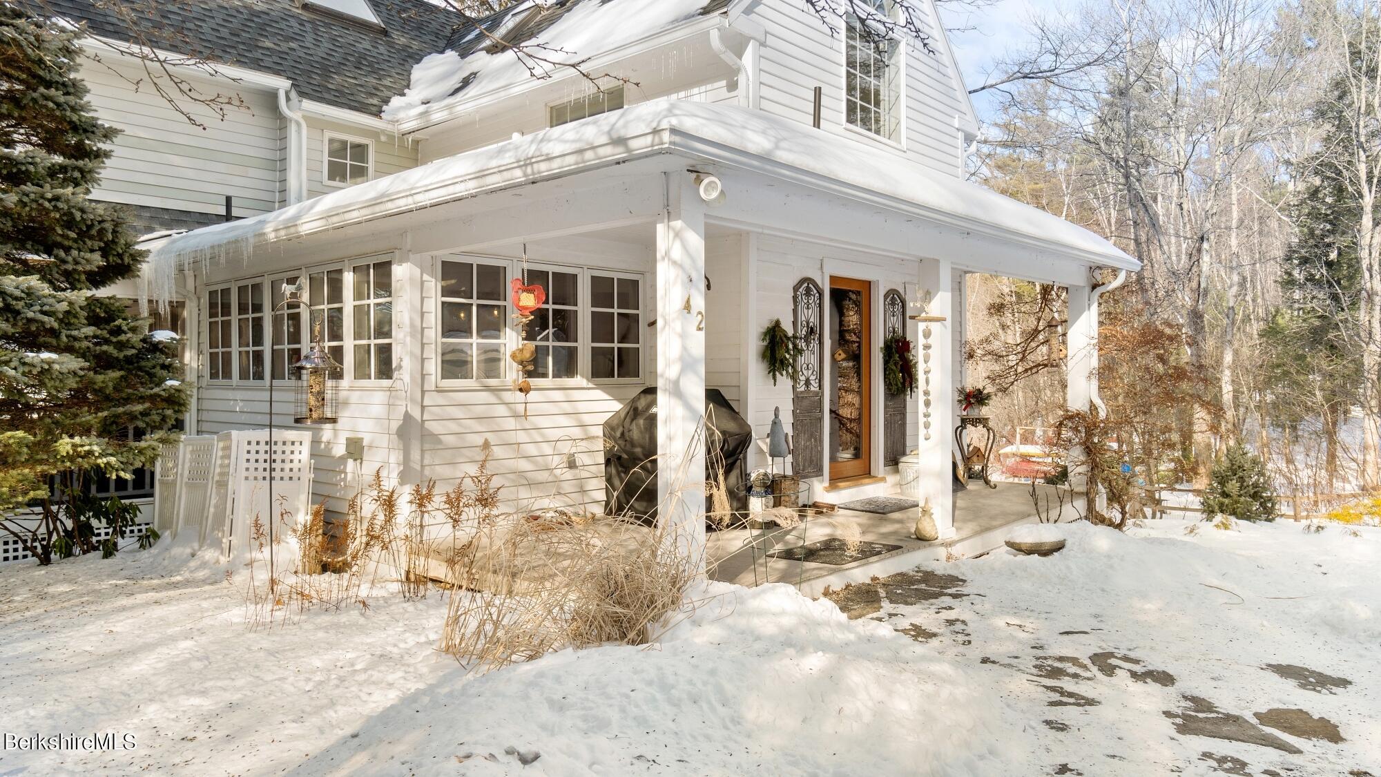42 Lake Rd Extension Richmond, MA 01201 - Photo 7 of 47 a front view of a house with a yard