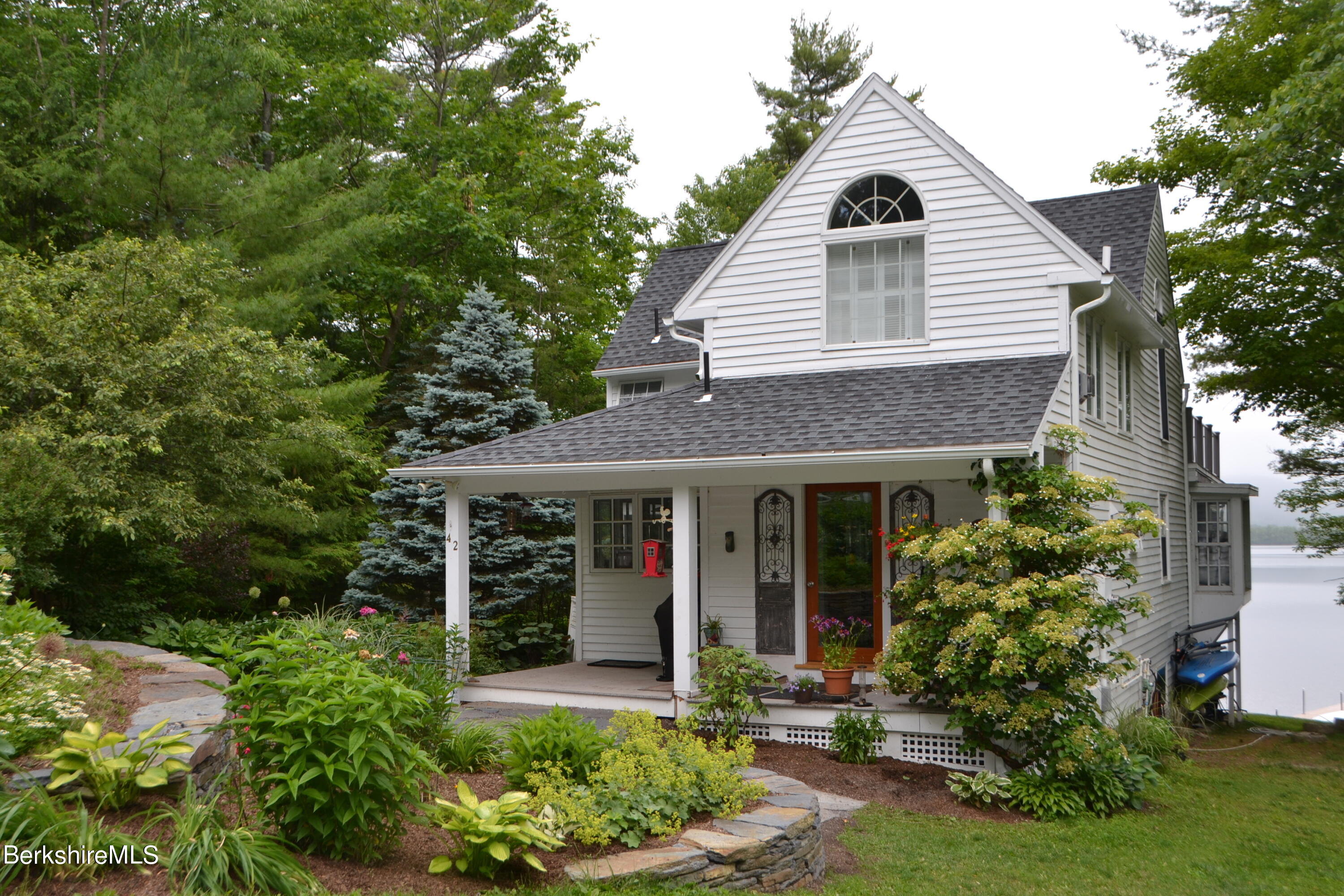 42 Lake Rd Extension Richmond, MA 01201 - Photo 8 of 47 a view of a house with a yard and plants
