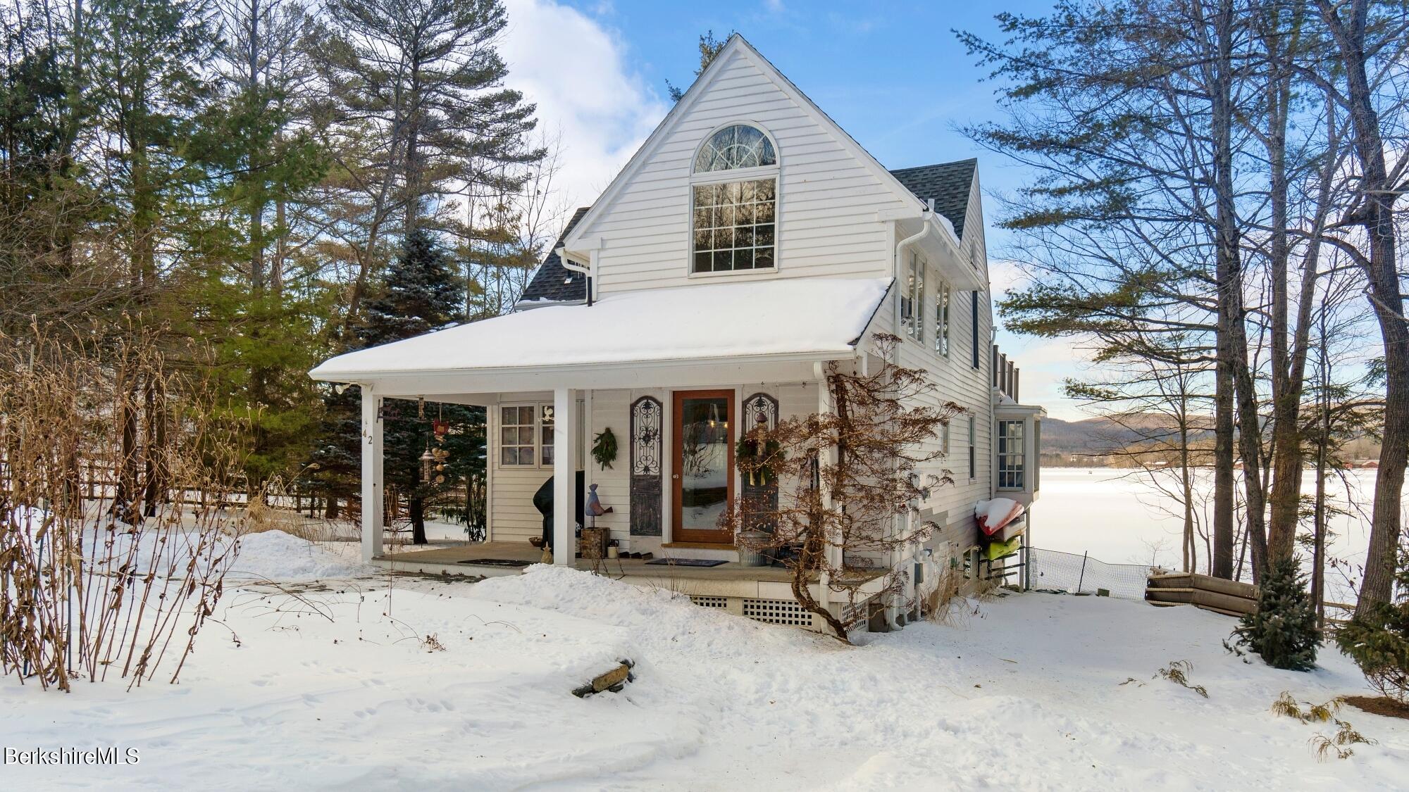 42 Lake Rd Extension Richmond, MA 01201 - Photo 9 of 47 a view of a house with a patio and backyard