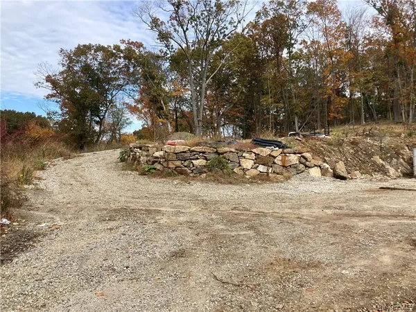 a view of a backyard of the house