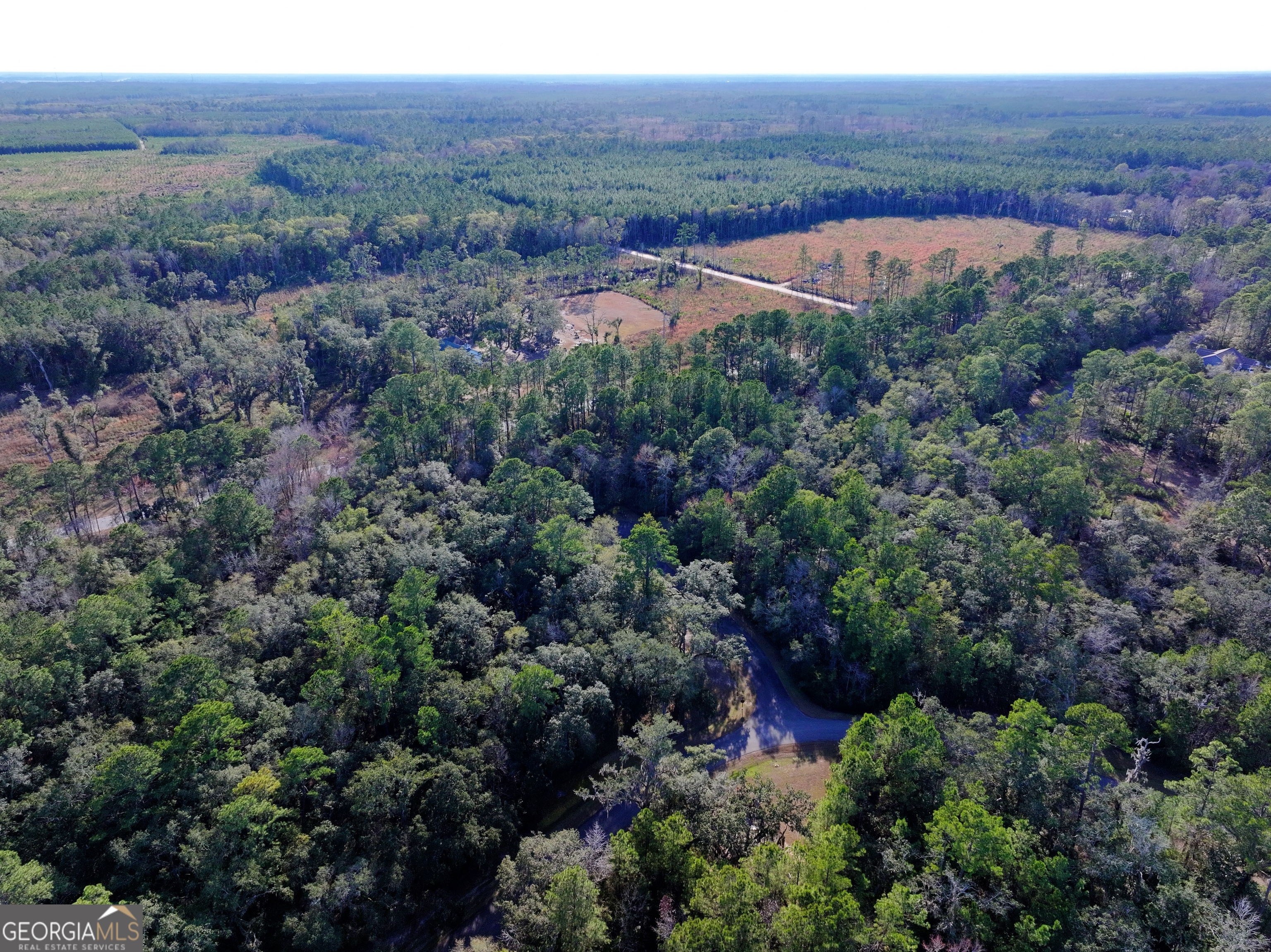 0 Merlin Court Waverly, GA 31565 - Photo 7 of 22 an aerial view of residential house and sandy dunes