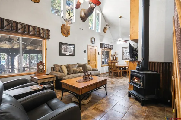 a living room with patio furniture and a window
