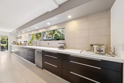 a kitchen with a sink and cabinets