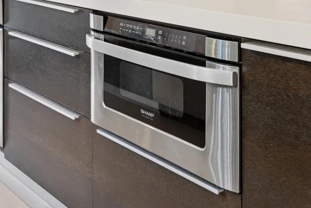 a kitchen with a sink and large window