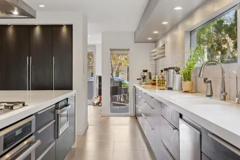 a kitchen with a table and chairs