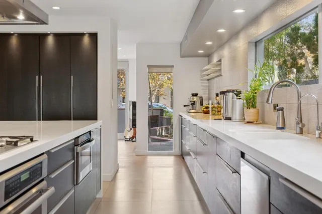 a kitchen with a table and chairs