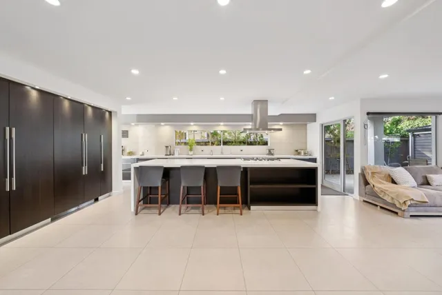 a lobby with a flat screen tv and a potted plant