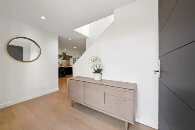 a living room with a couch and a large window with outer view