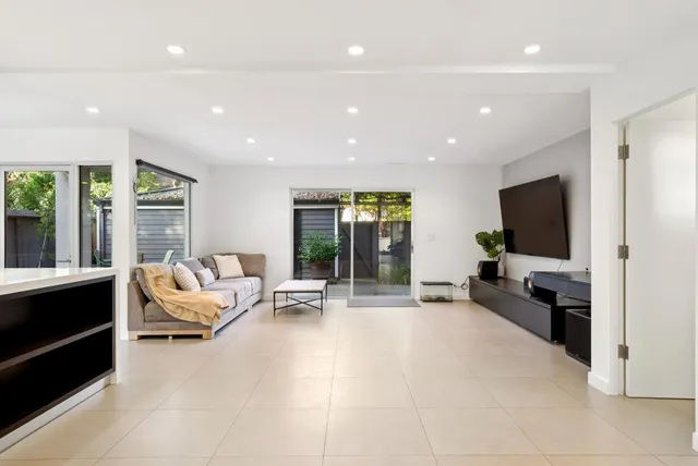 a bathroom with a sink mirror and toilet