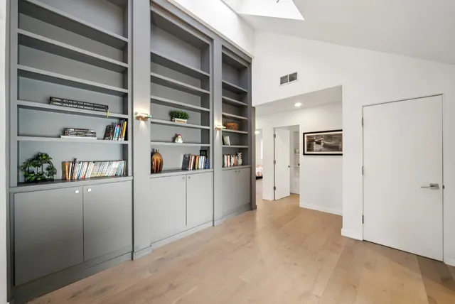 a spacious bathroom with a double vanity sink and a mirror