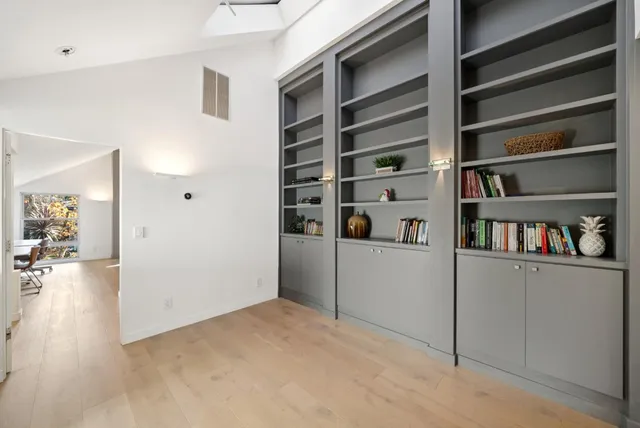 a bathroom with a double vanity sink and mirror