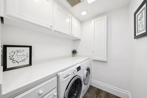 a view of a room with a large window and sitting area