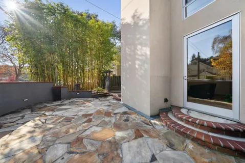 a view of a bedroom with a balcony