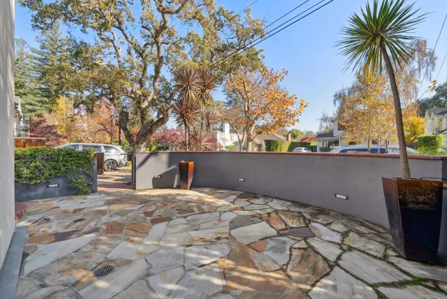 a view of a porch with furniture and a gate