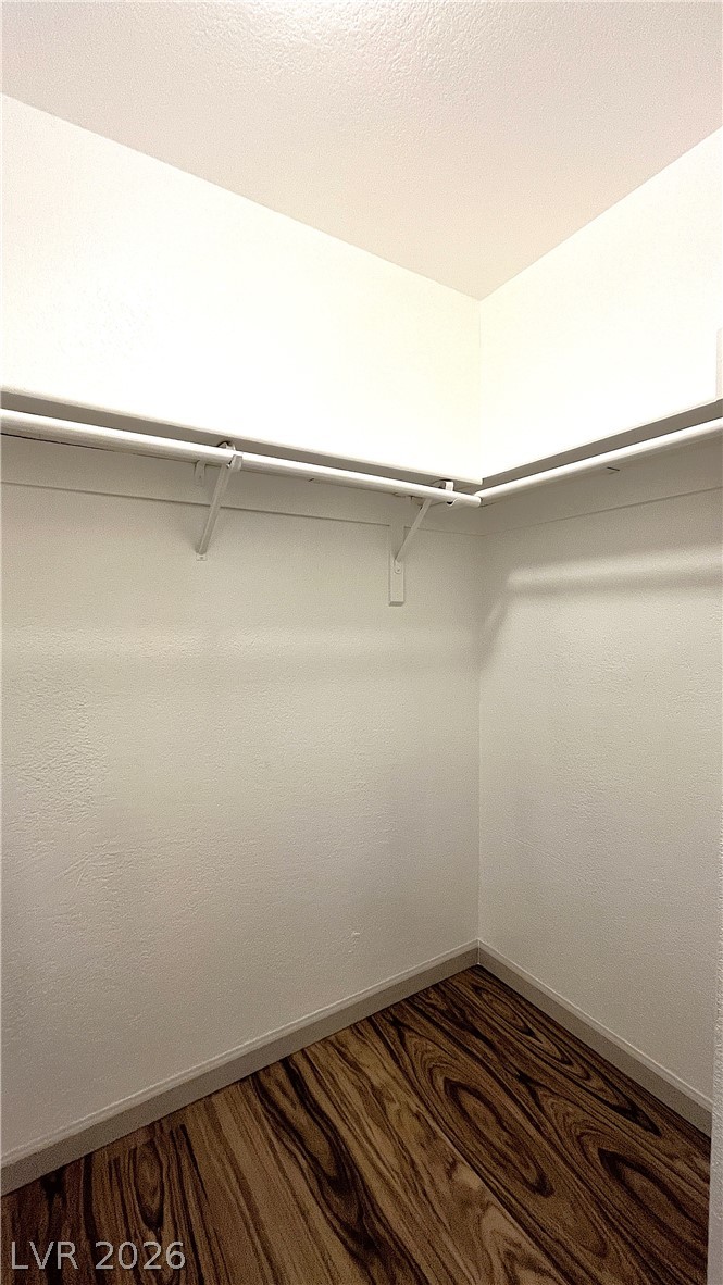 6750 Del Rey Avenue, Unit 123 Las Vegas, NV 89146 - Photo 13 of 21 Functional wardrobe featuring convenient shelving and sturdy hanging rods for organized storage.