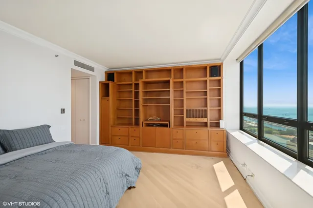 a view of a bedroom with a large window