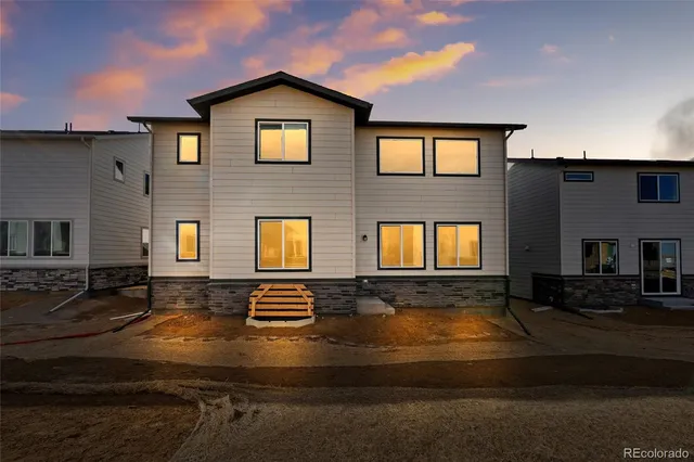 a front view of residential houses with yard