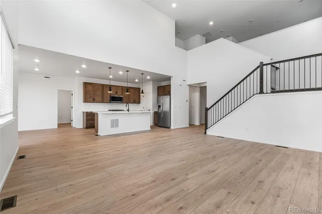 a view of kitchen with a sink and a stove top oven